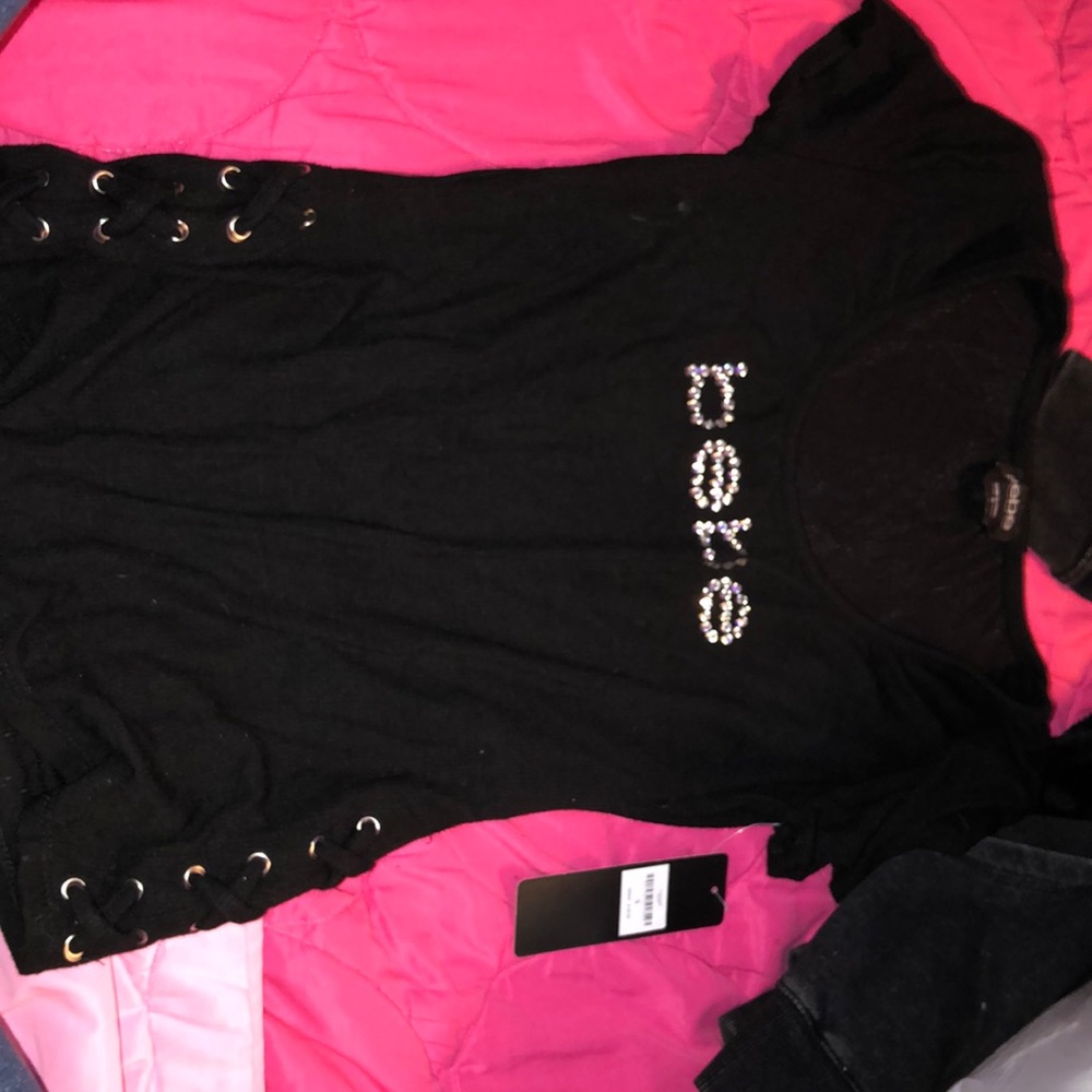 brand new black bebe shirt with tags, never worn